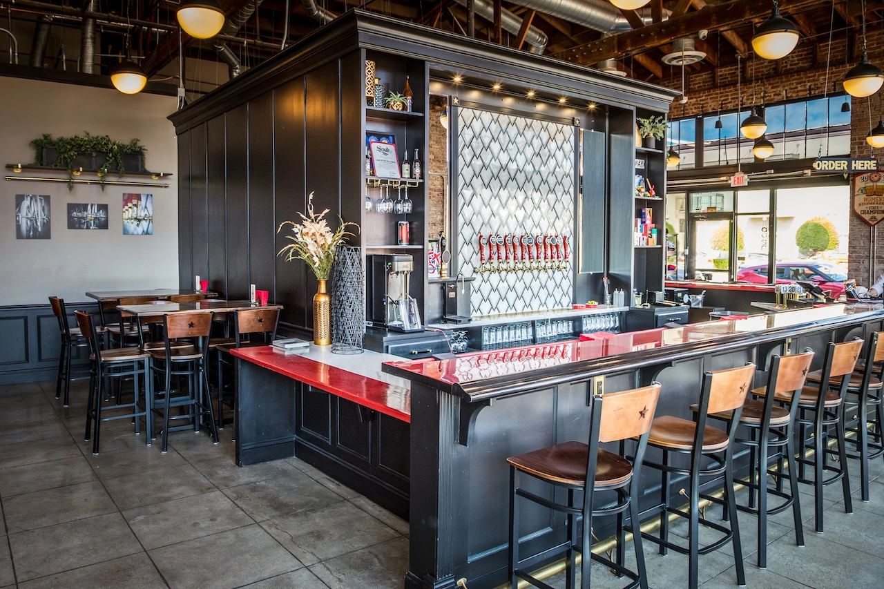 South of Shaw Beer Company taproom interior in downtown Fresno with craft beer taps and red bar top